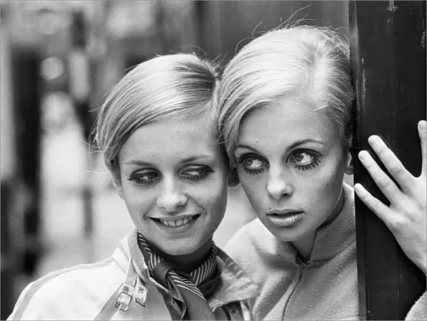 Model Twiggy seen here modelling a mini dress with her Swedish 'double'