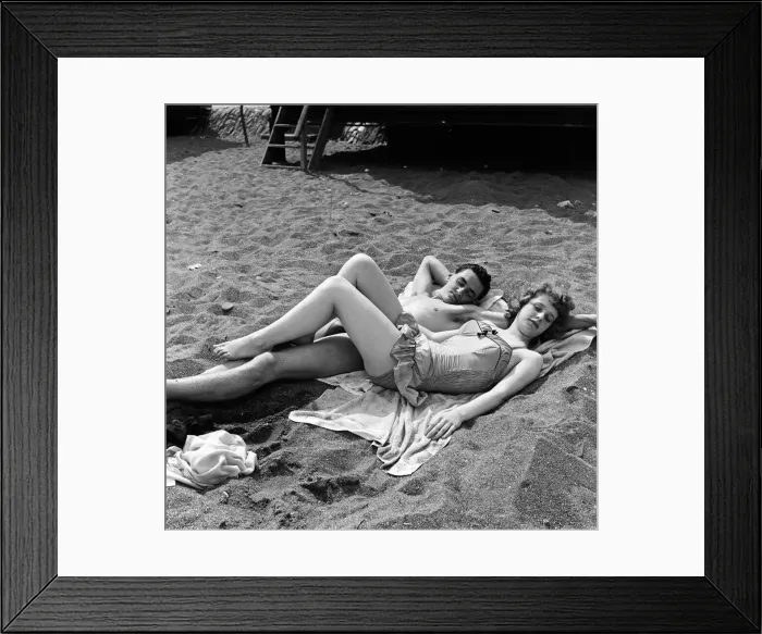 Framed Print : The sunbathing couple of youngsters are Mike Gardner, 19, a motor mechanic Framed Print : The sunbathing couple of youngsters are Mike Gardner, 19, a motor mechanic
