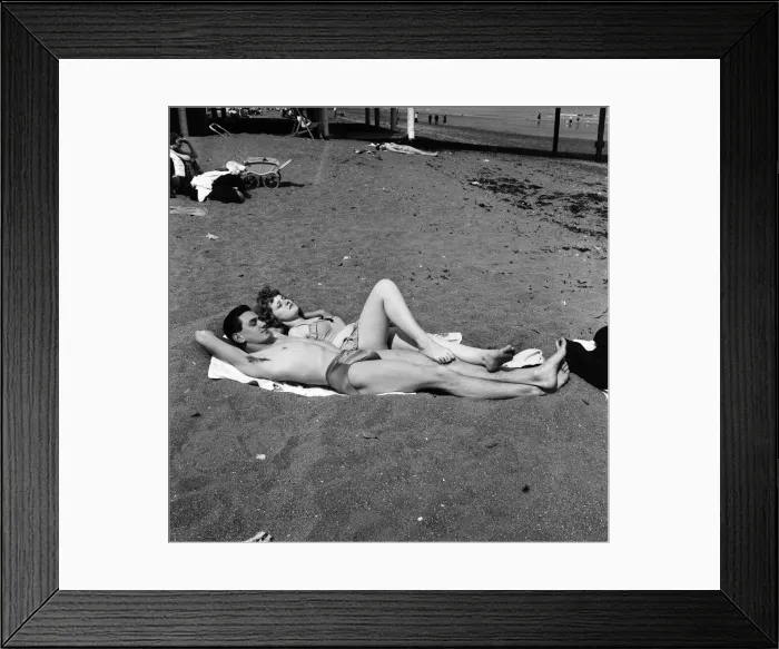 Framed Print : The sunbathing couple of youngsters are Mike Gardner, 19, a motor mechanic Framed Print : The sunbathing couple of youngsters are Mike Gardner, 19, a motor mechanic