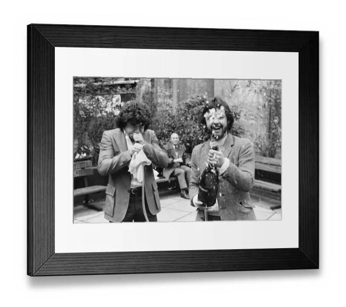 Framed Print : England footballer Kevin Keegan poses for photographers holding a large champagne bottle