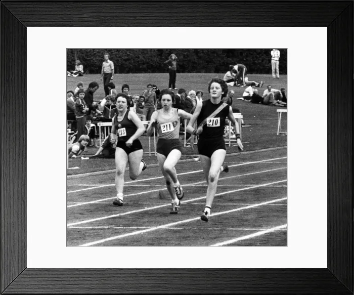 Framed Print : Melanie Moore (right), surges to the front in her heat of the junior girls sprint to give