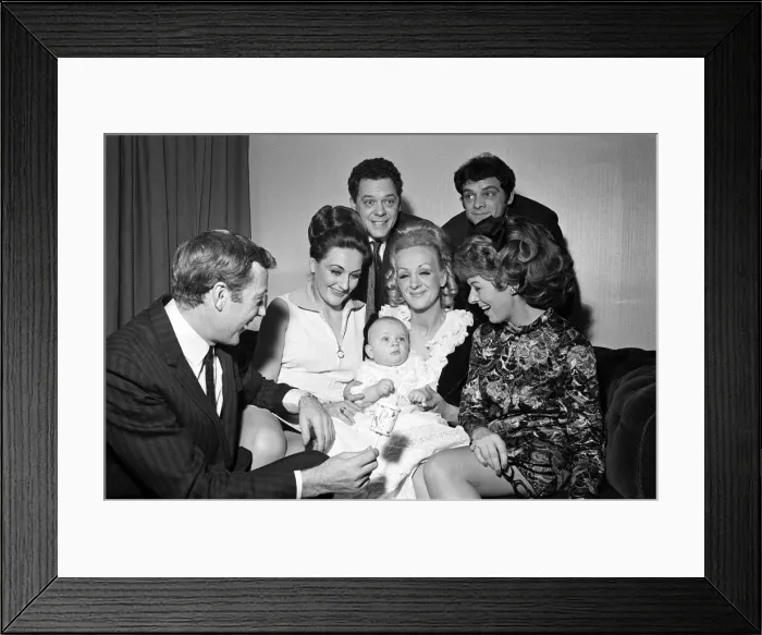 Framed Print : Val Doonican and his wife Lynn in supporting roles at the christening of baby Russell Framed Print : Val Doonican and his wife Lynn in supporting roles at the christening of baby Russell