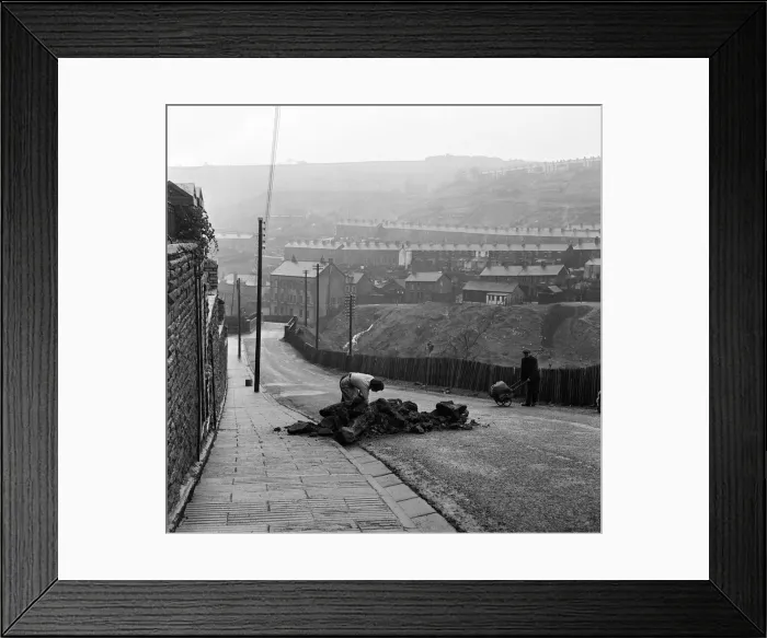 Framed Print : Mrs Annie Berry takes in her coal, which is delivered in a heap in the street Framed Print : Mrs Annie Berry takes in her coal, which is delivered in a heap in the street