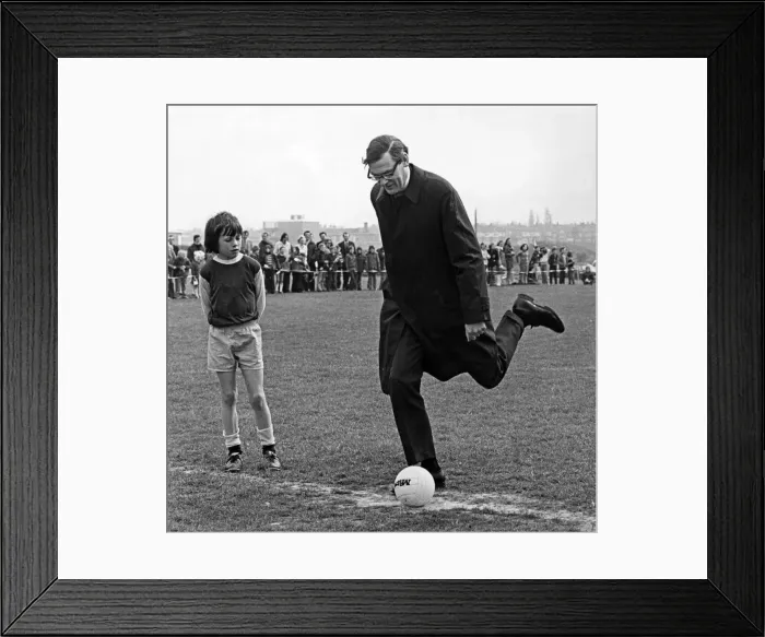 Framed Print : The Bishop of Durham, John Habgood, kicks off in the final between Holy Trinity CofE Framed Print : The Bishop of Durham, John Habgood, kicks off in the final between Holy Trinity CofE