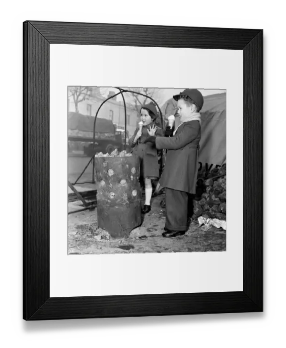Framed Print : Children warming themselves round the watchmans fire. 5th January 1956