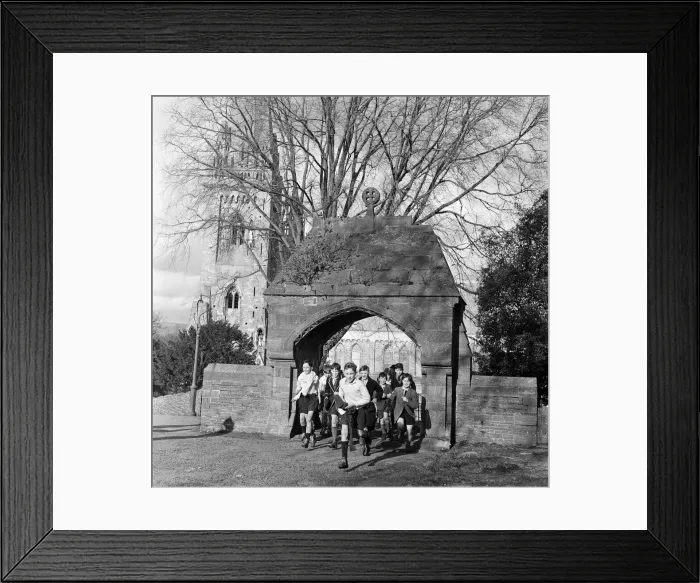 Framed Print : Scholars and choirboys of Llandaff Cathedral, South Wales, on their way to play rugby Framed Print : Scholars and choirboys of Llandaff Cathedral, South Wales, on their way to play rugby