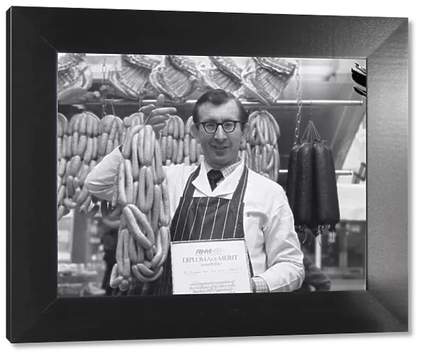Robert Thompson Dix in his North Tyneside shop holds a string of sausages
