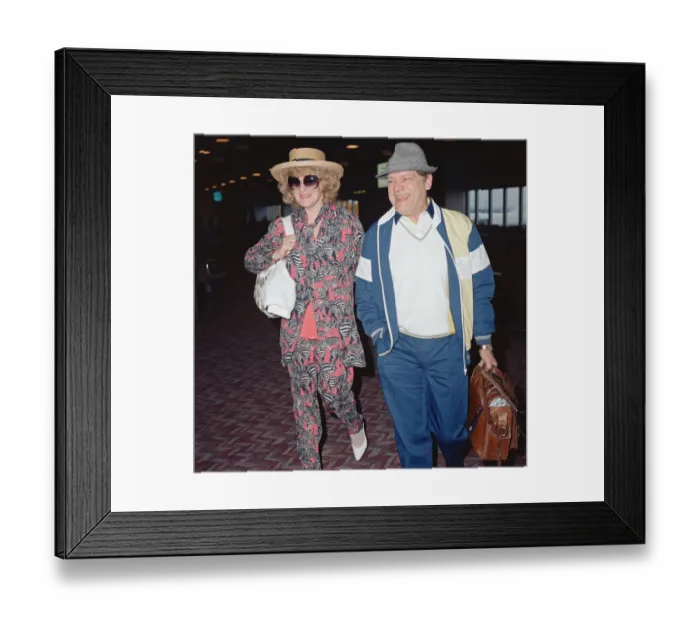 Framed Print : Actor David Jason and girlfriend Myfanwy Talog leaving Heathrow Airport for a holiday in