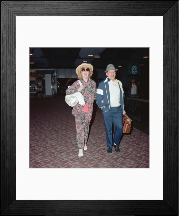 Framed Print : Actor David Jason and girlfriend Myfanwy Talog leaving Heathrow Airport for a holiday in
