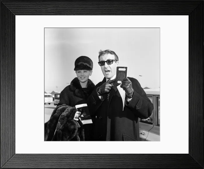 Framed Print : Actor Peter Sellers at London Airport with his wife Britt Ekland