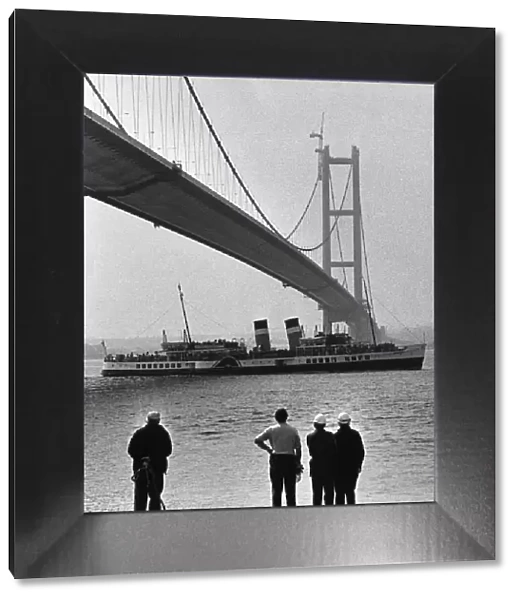 The paddle steamer Waverley passes under the Humber Bridge as it nears completion
