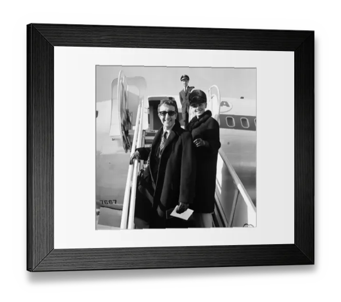 Framed Print : Actor Peter Sellers at London Airport with his wife Britt Ekland Framed Print : Actor Peter Sellers at London Airport with his wife Britt Ekland