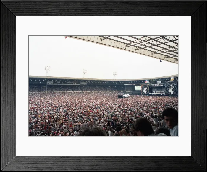 Framed Print : Live Aid concert held at Wembley Stadium, London to raise funds for relief of the ongoing Framed Print : Live Aid concert held at Wembley Stadium, London to raise funds for relief of the ongoing