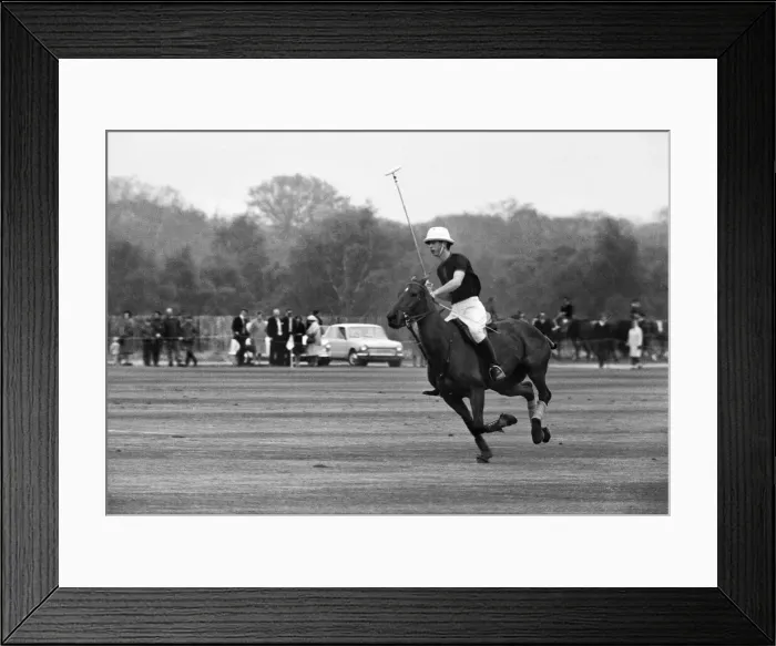 Framed Print : Prince Charles in action during his first polo game at Windsor Park alongside his father