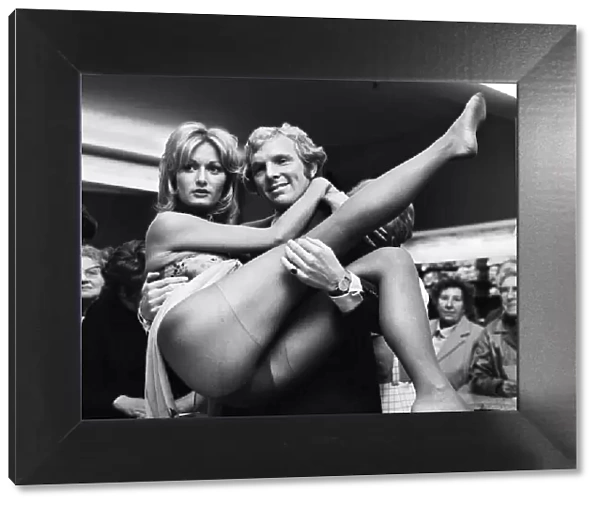 West Ham and England football star Bobby Moore with model Kate Howard in Oxford Street