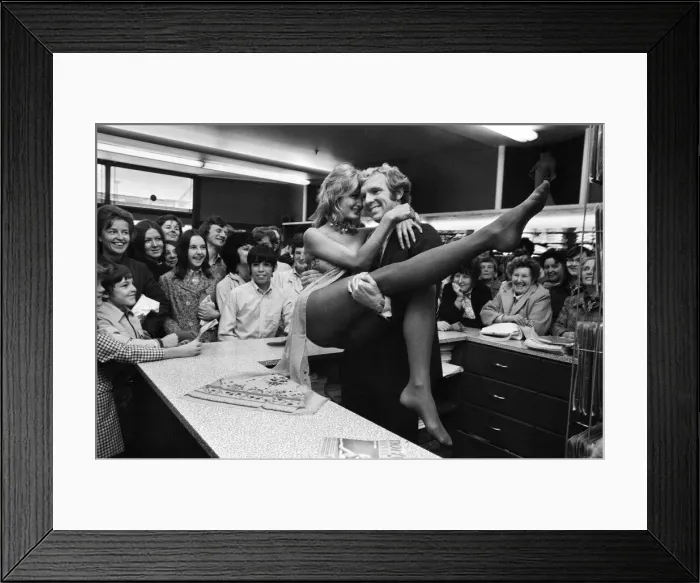 Framed Print : West Ham and England football star Bobby Moore with model Kate Howard in Oxford Street Framed Print : West Ham and England football star Bobby Moore with model Kate Howard in Oxford Street
