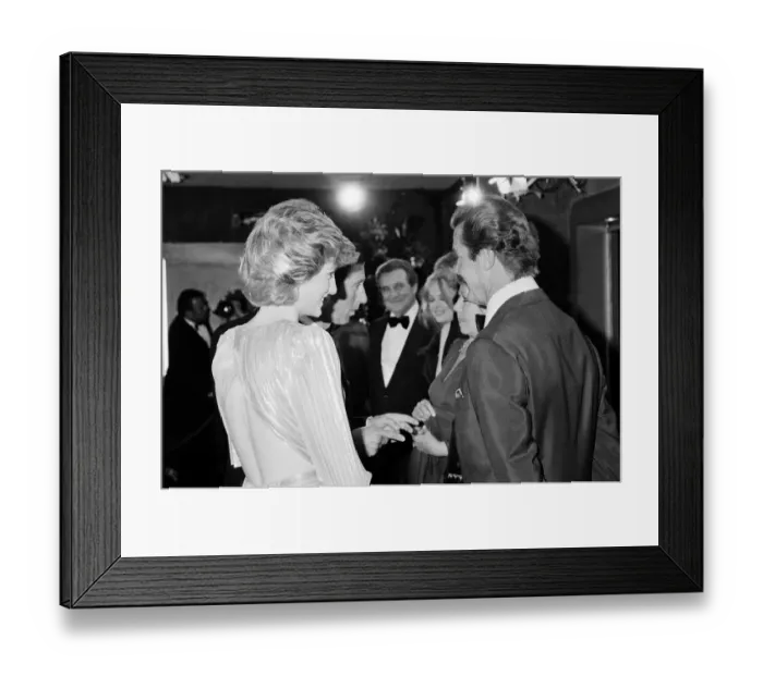 Framed Print : HRH The Princess of Wales, Princess Diana talking with lead actor Roger Moore