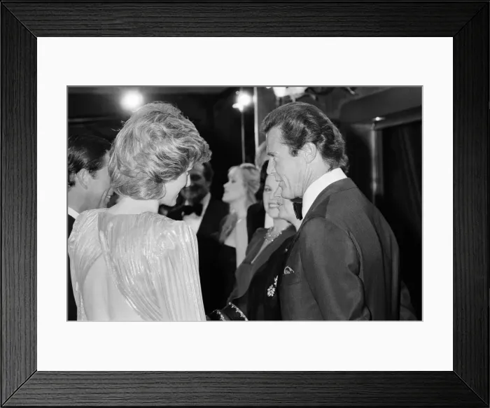 Framed Print : HRH The Princess of Wales, Princess Diana talking with lead actor Roger Moore Framed Print : HRH The Princess of Wales, Princess Diana talking with lead actor Roger Moore