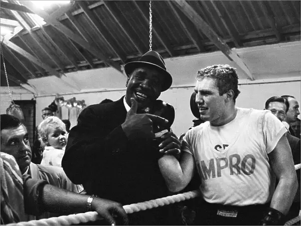 Sonny Liston, World Heavyweight Champion, visits the training camp of British boxer