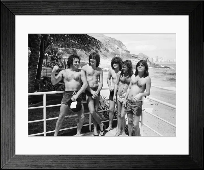 Framed Print : Australian rock group AC  /  DC takes time to relax at Ipanema beach in Rio De Janeiro
