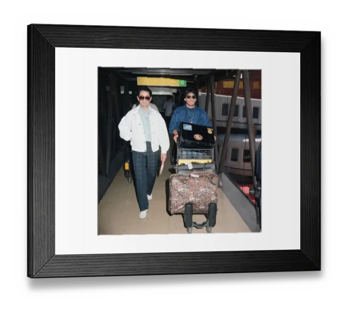 Framed Print : Argentina footballers Diego Maradona is met by his friend