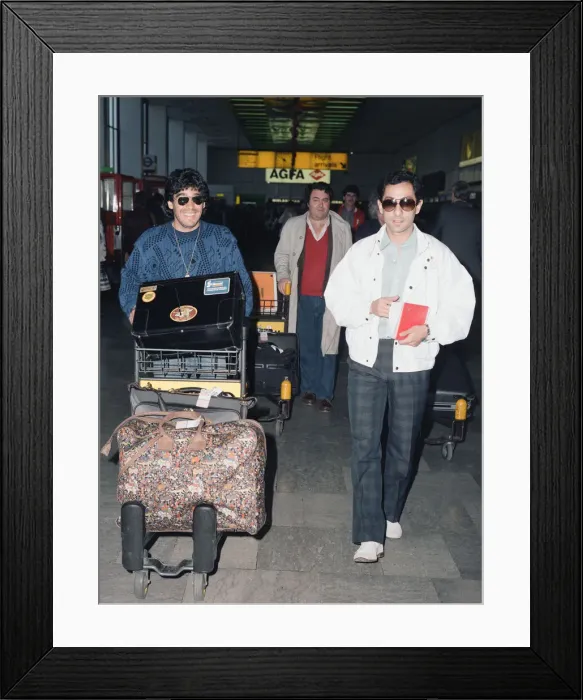 Framed Print : Argentina footballers Diego Maradona is met by his friend Framed Print : Argentina footballers Diego Maradona is met by his friend