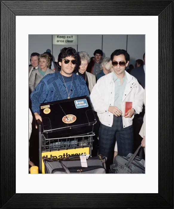 Framed Print : Argentina footballers Diego Maradona is met by his friend Framed Print : Argentina footballers Diego Maradona is met by his friend