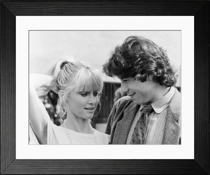 Framed Print : John Travolta and his co star Olivia Newton John in England during the week of release of