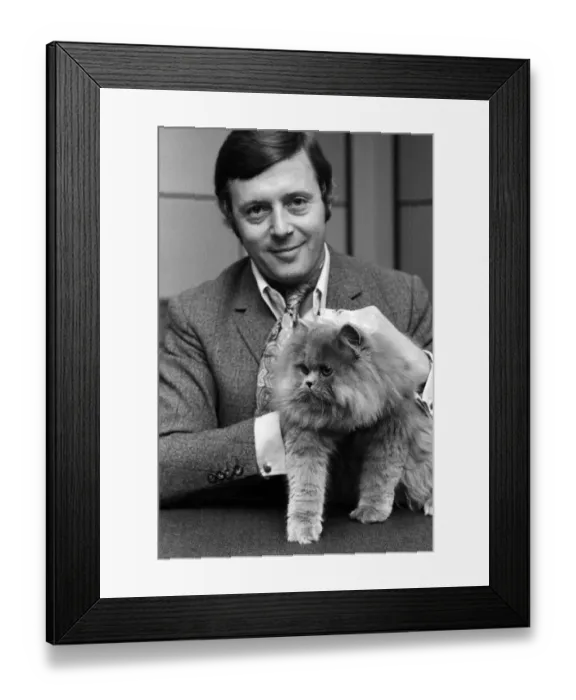Framed Print : BBC commentator Michael Aspel at the BBC Studios at Lancaster Gate with a cat who is a Framed Print : BBC commentator Michael Aspel at the BBC Studios at Lancaster Gate with a cat who is a