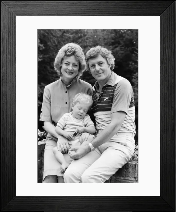 Framed Print : Michael Aspel pictured at home with his wife Lizzie Power and their son. September 1982 Framed Print : Michael Aspel pictured at home with his wife Lizzie Power and their son. September 1982