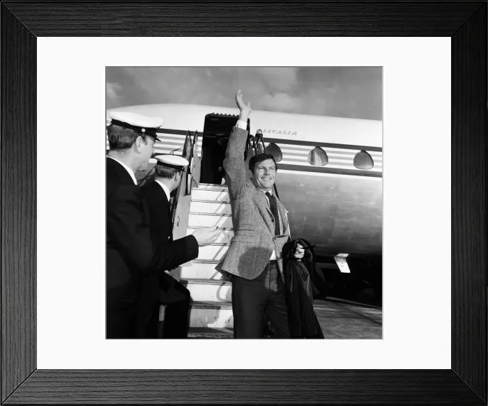 Framed Print : Adam West, who plays Batman on TV, pictured on arrival at Heathrow Airport. 7th May 1967 Framed Print : Adam West, who plays Batman on TV, pictured on arrival at Heathrow Airport. 7th May 1967