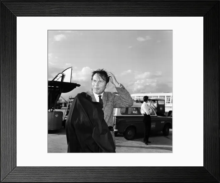 Framed Print : Adam West, who plays Batman on TV, pictured on arrival at Heathrow Airport. 7th May 1967 Framed Print : Adam West, who plays Batman on TV, pictured on arrival at Heathrow Airport. 7th May 1967