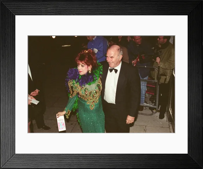 Framed Print : Clive James arrives for the 1995 Comedy Awards with Margarita Pracatan Framed Print : Clive James arrives for the 1995 Comedy Awards with Margarita Pracatan