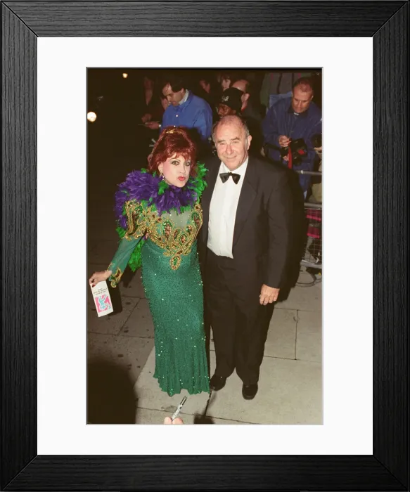 Framed Print : Clive James arrives for the 1995 Comedy Awards with Margarita Pracatan
