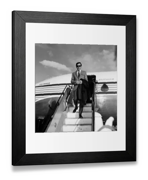 Framed Print : Adam West, who plays Batman on TV, pictured on arrival at Heathrow Airport. 7th May 1967