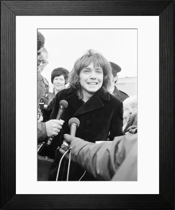 Framed Print : David Cassidy, singer, actor and musician, arrives at Luton Airport to start his