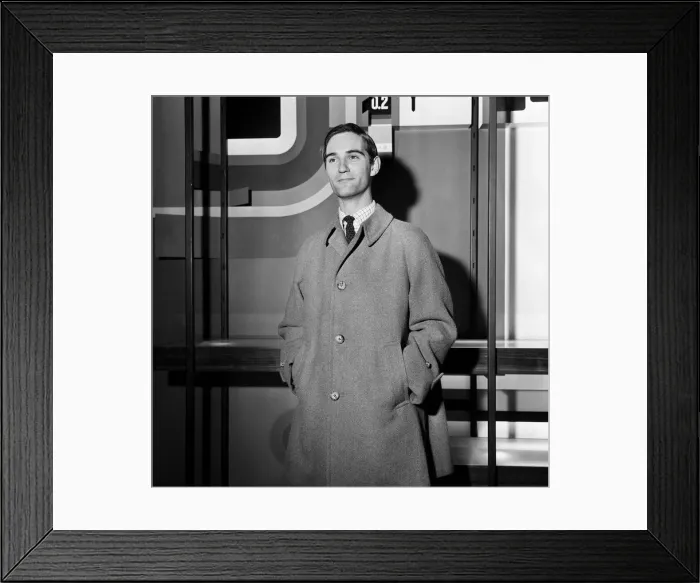 Framed Print : A man modelling an overcoat. 24th August 1965