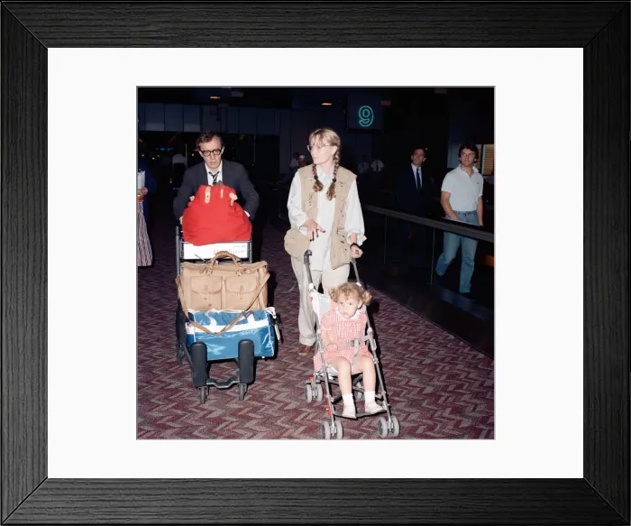 Framed Print : Woody Allen and his partner, actress Mia Farrow, with some of their children at London