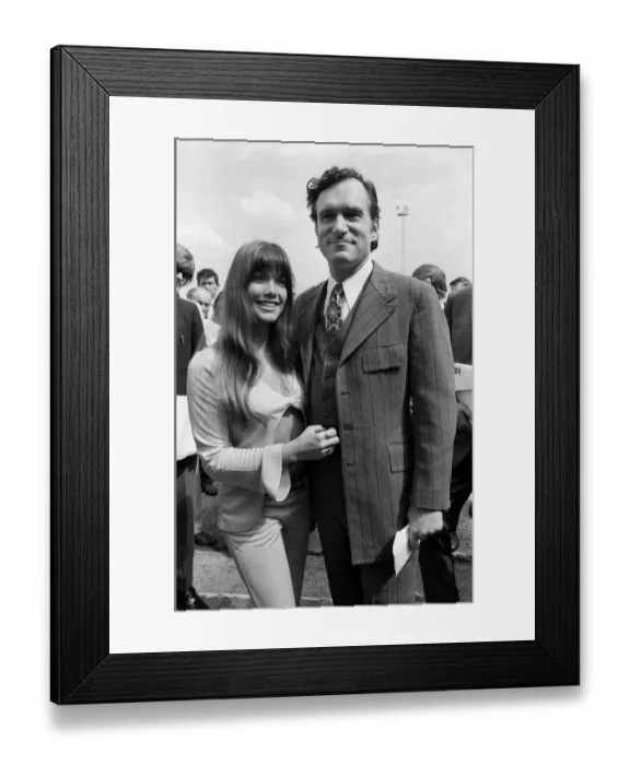 Framed Print : Playboy Editor and Publisher Hugh Hefner arrives at Heathrow Airport in his private