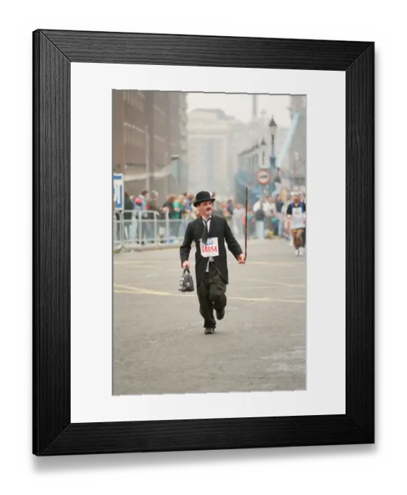 Framed Print : The London Marathon - 1990 Runners pass through and around the Tower Bridge area Framed Print : The London Marathon - 1990 Runners pass through and around the Tower Bridge area