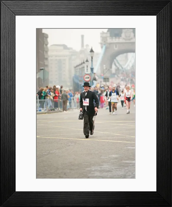 Framed Print : The London Marathon - 1990 Runners pass through and around the Tower Bridge area Framed Print : The London Marathon - 1990 Runners pass through and around the Tower Bridge area