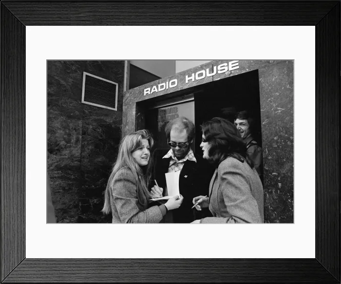 Framed Print : Elton John makes a whistle-stop visit to Birmingham and spends an hour as a disc jockey