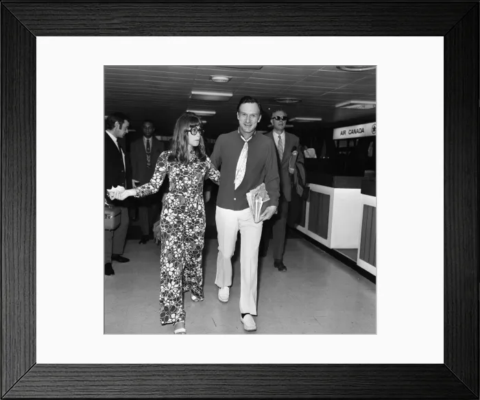 Framed Print : Hugh Hefner pictured with his girlfriend Barbi Benton at the airport. 6th September 1969 Framed Print : Hugh Hefner pictured with his girlfriend Barbi Benton at the airport. 6th September 1969