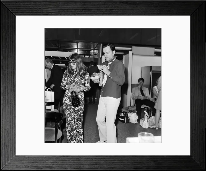 Framed Print : Hugh Hefner pictured with his girlfriend Barbi Benton at the airport. 6th September 1969 Framed Print : Hugh Hefner pictured with his girlfriend Barbi Benton at the airport. 6th September 1969