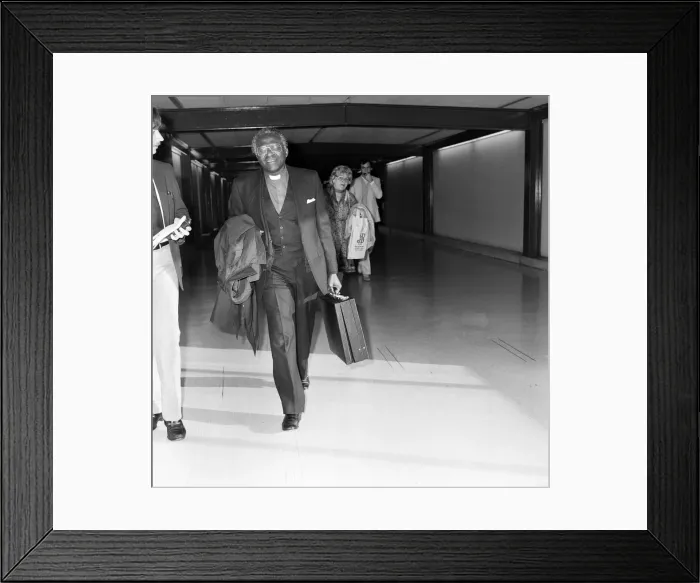 Framed Print : Bishop Desmond Tutu en route from South Africa to Vancouver at Heathrow Airport Framed Print : Bishop Desmond Tutu en route from South Africa to Vancouver at Heathrow Airport