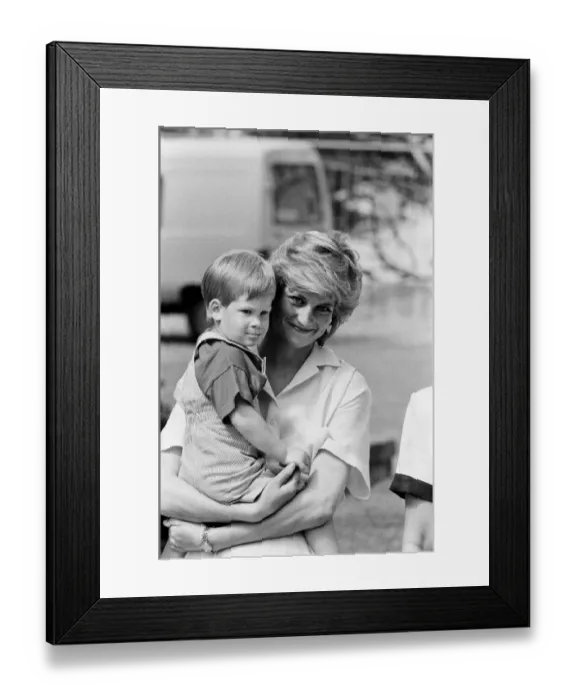 Framed Print : HRH Princess Diana, The Princess of Wales holds her young son Prince Harry on holiday in Framed Print : HRH Princess Diana, The Princess of Wales holds her young son Prince Harry on holiday in
