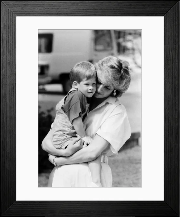Framed Print : HRH Princess Diana, The Princess of Wales holds her young son Prince Harry on holiday in Framed Print : HRH Princess Diana, The Princess of Wales holds her young son Prince Harry on holiday in