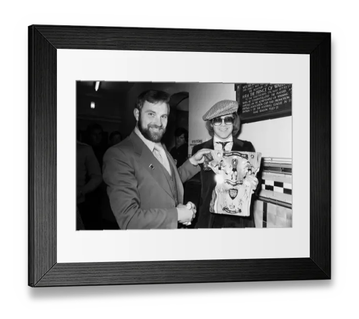 Framed Print : Musician and Watford FC chairman Elton John is presented with a special Jubilee plaque