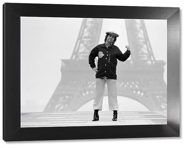 Elton John pictured in Paris in front of the Eiffel Tower