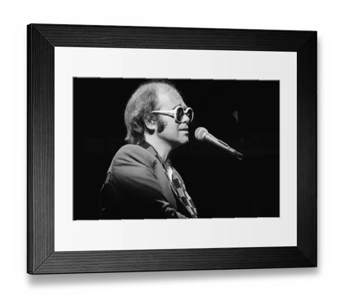 Framed Print : Elton John performing on stage, during the Elton John and Ray Cooper concert tours Framed Print : Elton John performing on stage, during the Elton John and Ray Cooper concert tours